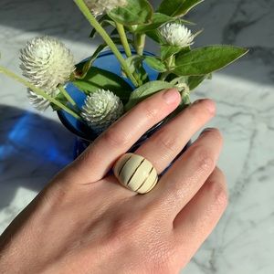 Gold and off-white ring